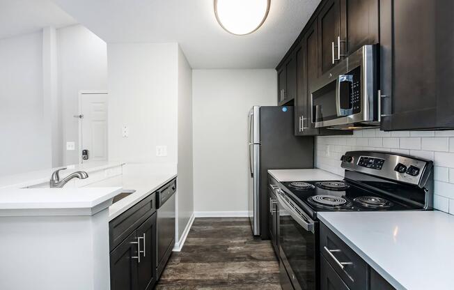 a kitchen with a stove and a sink
