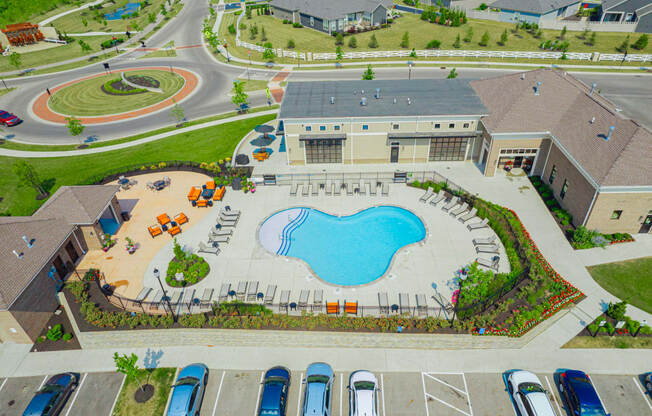 an aerial view of a large swimming pool in a parking lot