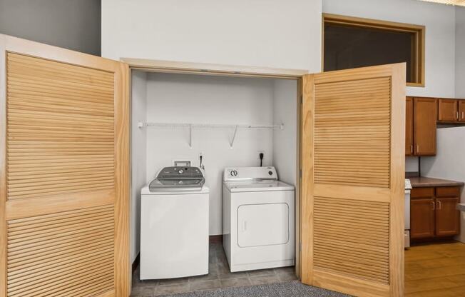 a laundry room with a washing machine and a dryer in it