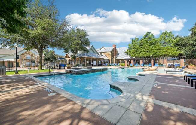 the swimming pool at the preserve at polo ridge apartments tx