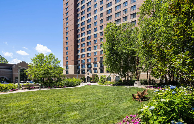 a park in front of a tall building