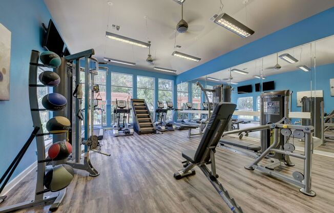 community gym with windows and hardwood floors