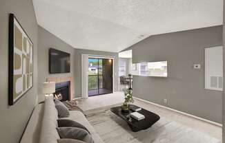 A living room with a fireplace and a couch.