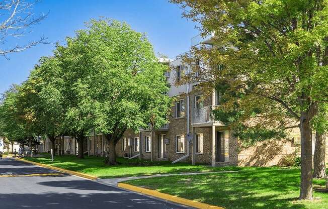 tree lined street at fountains in the park apartments