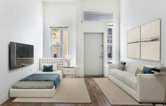 a bedroom with a bed and a couch