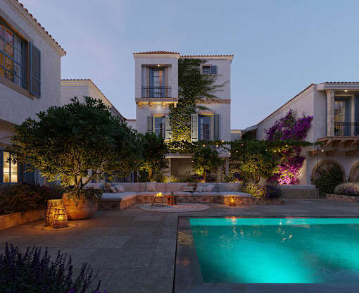 a house with a pool and a courtyard at night