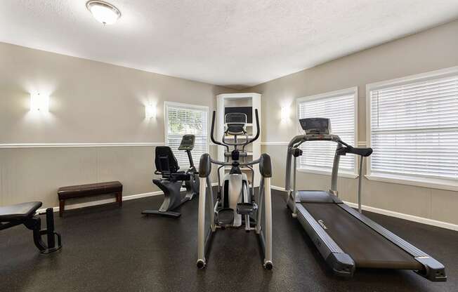 Fitness center at Briarwood Apartments, Columbus, IN, with cardio exercise equipment.