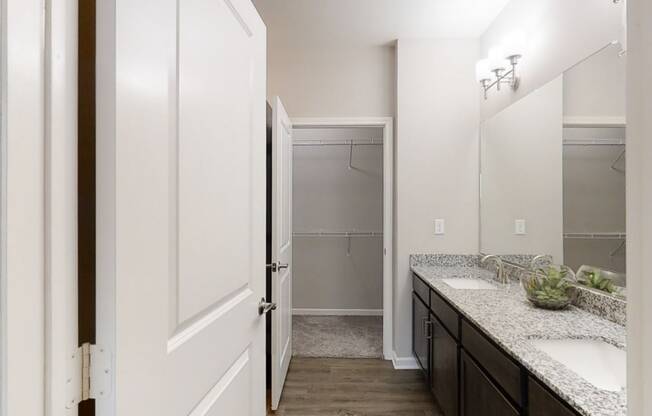 Bathroom Vanity with Double Sinks and Attached Walk-In Closet