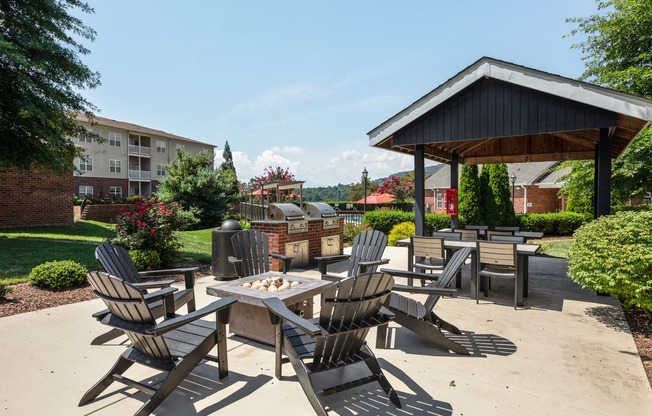 Outdoor sitting area with fireplace at Westmont Commons apartments for rent in Asheville, NC
