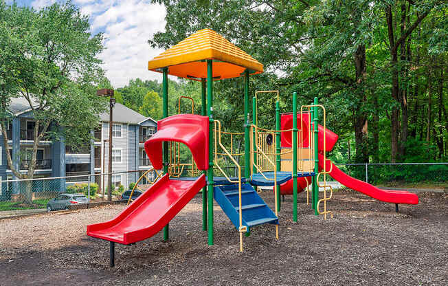 a playground with slides and a swing set