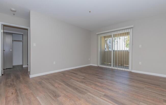 a large empty room with a wooden floor
