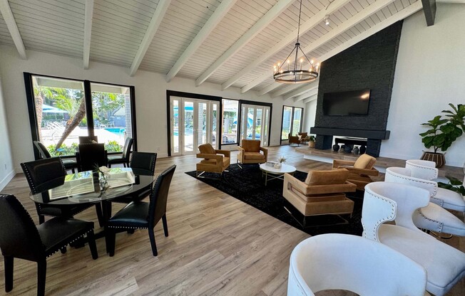 a living room filled with furniture and a large window