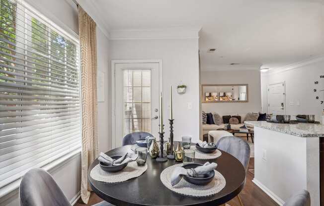 a dining room with a table and chairs