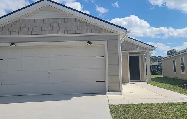 Charming 3/2 in a prime location with multiple upgrades including attache garage and screened in lanai