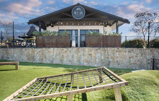 Press Café at The District offers a relaxed outdoor setting for coffee or bites, just minutes from Modera Walsh Heights.