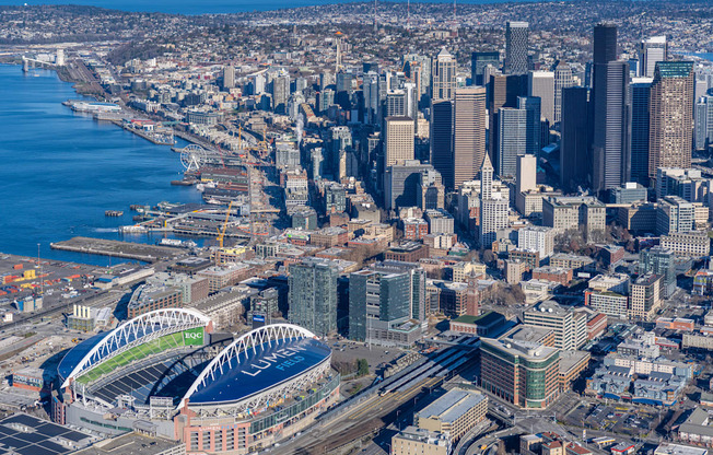 an aerial view of the city with the convention center and the stadium
