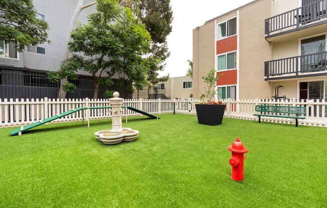 Two-BR Apartments In Culver City, CA - Parkway Plaza - Dog Park With Obstacles, Turf, And Bench