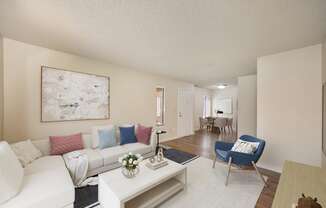 a living room with a white couch and a coffee table