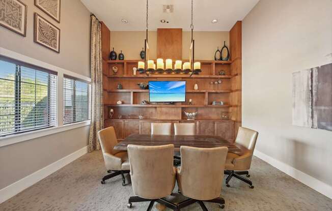 a dining room with a table and chairs