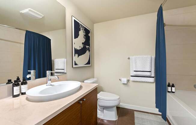 A bathroom with a white toilet and a white sink.