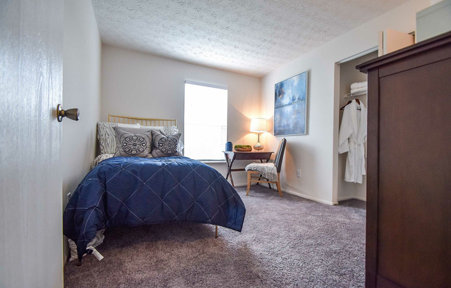 Experience comfort and style in this beautifully furnished bedroom space.