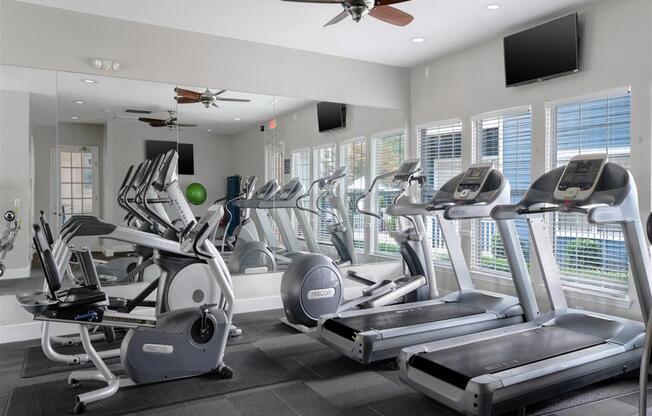 a fitness center with treadmills