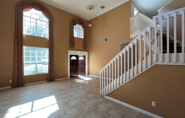 Executive 4/3.5 Pool Home with Water View w/3-Car Garage in Lee Vista Area close to Lake Nona