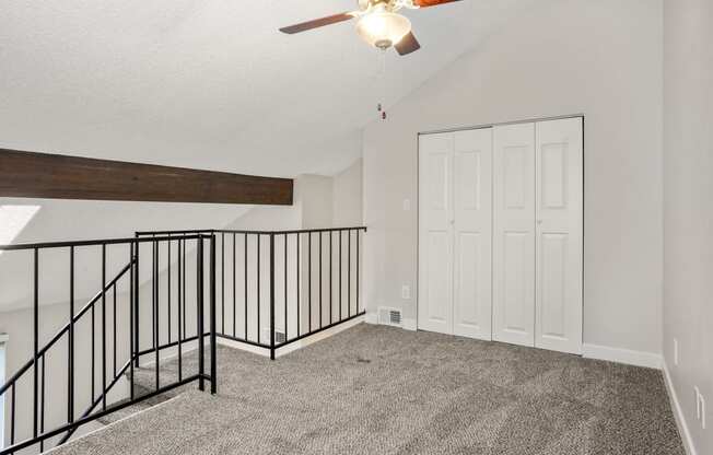 An upstairs loft with closet at Hilltop View Apartments