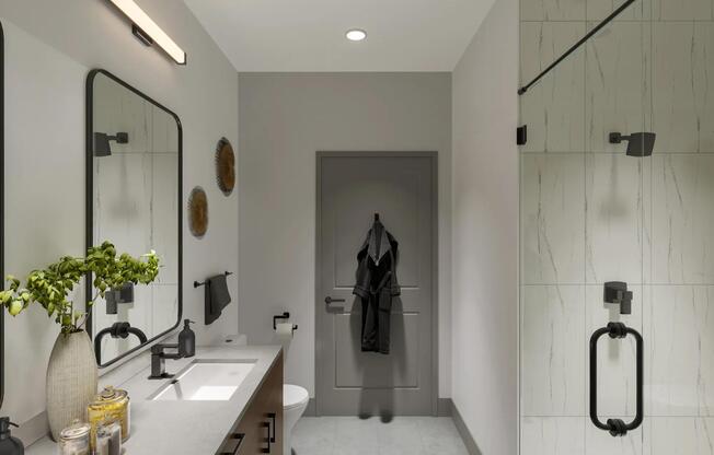 Dual entrance bathrooms with pass through closets and linen closets are available in select apartments at Modera SoBro.