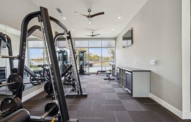 fitness center with exercise equipment at LynnCora, Grand Prairie, TX