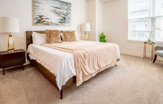 a bedroom with a bed and two windows