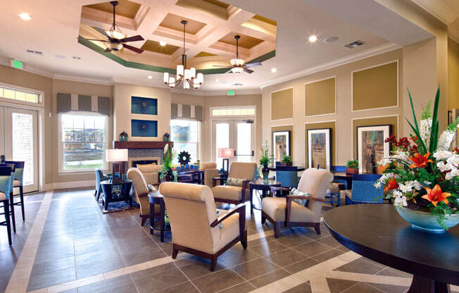 A large room with a table and chairs in it.