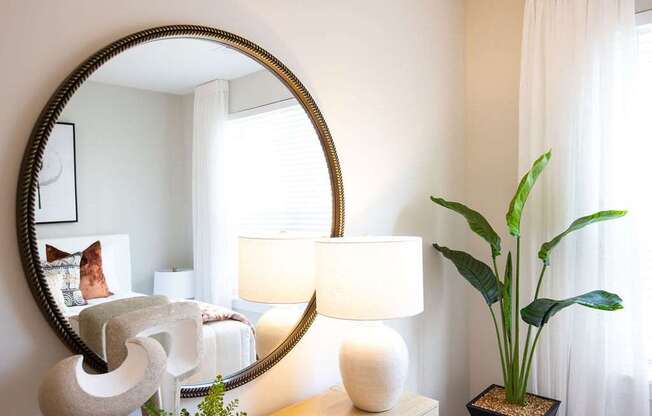 a bedroom with a large mirror on the wall