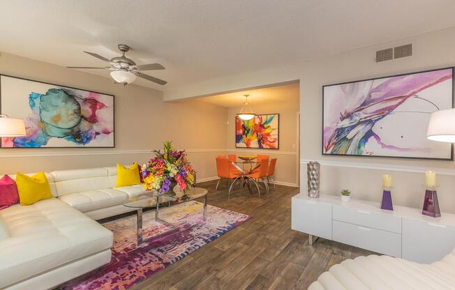 a living room filled with furniture and a flat screen tv