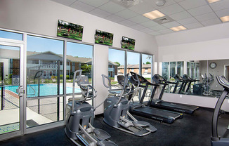 fitness center overlooking pool at north park apartments