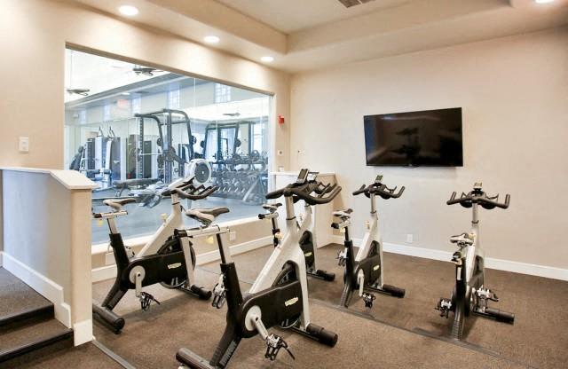 The Highland Apartments Fitness Studio with spin bikes and fitness on demand tv