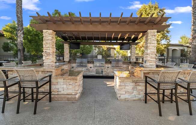 Estancia at Mission Grove Apartments Grilling Area with Bar Seating