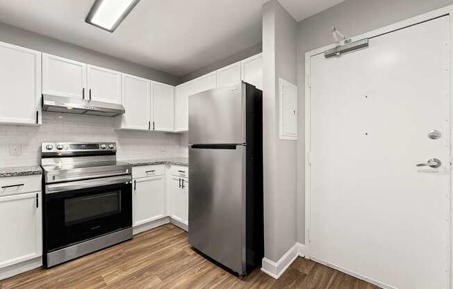 Upgraded kitchen with stainless steel appliances at Crogman School Lofts, Atlanta GA 30315