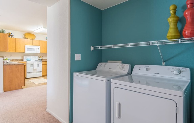 Desert Sands laundry room with a standard washer and dryer.