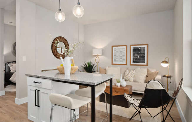 A modern kitchen with a dining table and chairs.