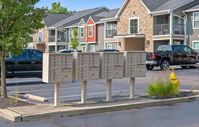 a street sign with mailboxes in front of a row of houses