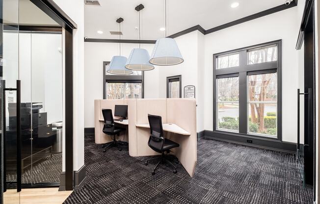 a conference room with a table and chairs and a large window