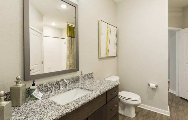 spacious bathroom vanity and toilet nook