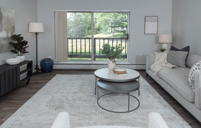 Living Room With Private Balcony at Audenn Apartments, Bloomington