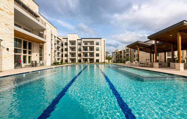 Lenox SoCo Apartments large swimming pool with apartments in the background