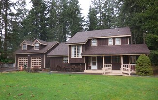 Coming January 2025! Everett Home on large lot with detached garage and tons of storage!