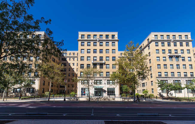A large building with a tree in front of it.