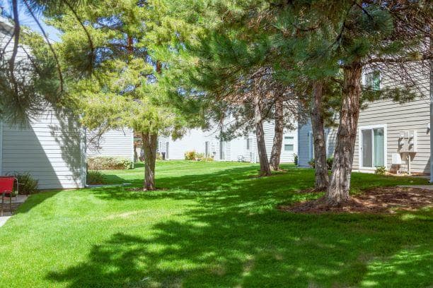 Green Spaces With Mature Trees at Devonshire Court Apartments & Townhomes, Utah