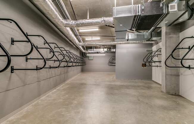 the lobby of the building has a wall of bike racks