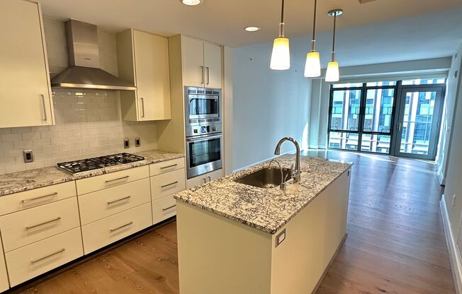 Stunning 2 bed (Primary bedroom + den w/closet), 2 bath condo located in the heart of downtown Bethesda.